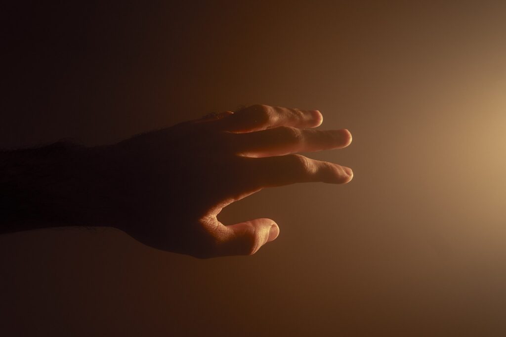 The Power of Hello: Free Verse Poem 2 A hand reaching out to another with an Hello, symbolizing a gesture of kindness and support.