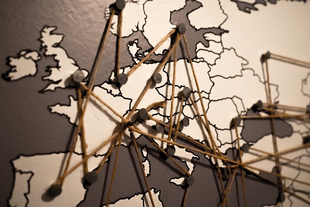 Many Things about Tomorrow: Finale Episode: The Transformative Vision 2 A world map highlighting new innovation hubs in various countries, with Liam in the foreground, symbolizing the global spread of his vision and initiatives.