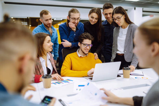 Many Things About Tomorrow: Episode 11: The Empowered Legacy Triumphant 2 Inside a high-tech innovation hub, a group of young innovators from various backgrounds collaborate on a project, showcasing the legacy of empowerment and innovation.