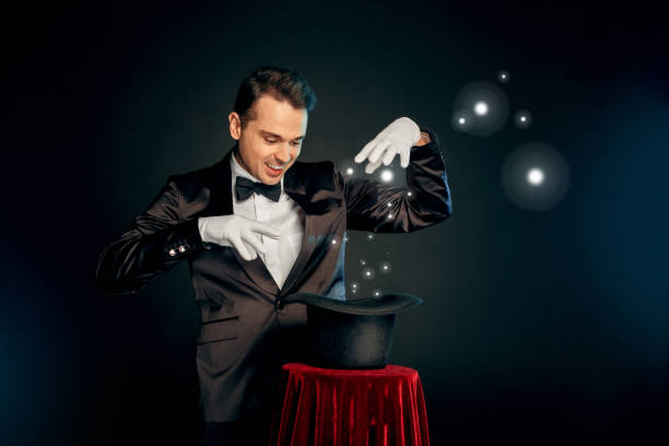 The magician Alaric performing captivating tricks on stage, revealing himself as a fellow Dream Walker to Edgar